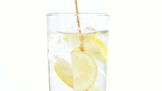 water with lemon and ice isolated on white background