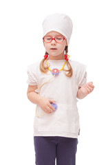 young girl with glasses plays in the doctor