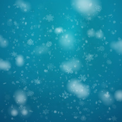 snowfall from New Year's snowflakes on a blue background.