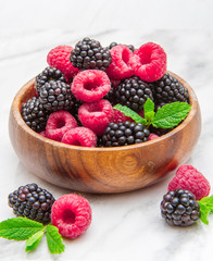 Wooden cup with fresh berries 