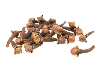 A heap of dried cloves on a white background