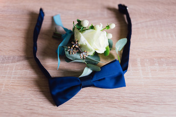 the groom's bouquet lies on the floor near the butterfly