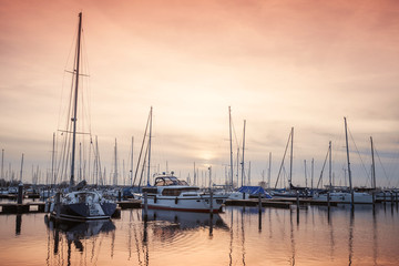 Fototapeta na wymiar Sailing yachts moored in Muiderzand marina