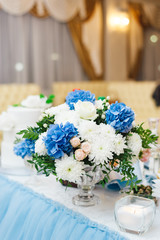 a bouquet of fresh flowers is on the wedding table of the bride