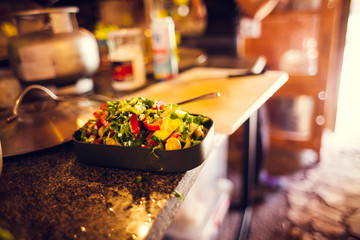 Salad on the kitchen table.