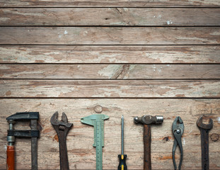 Row of old tools in wooden table