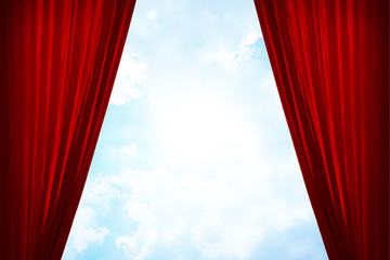 Red curtain and bright blue sky background