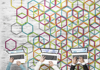 Top view of businesspeople sitting at table and using gadgets