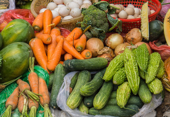 market stall with vegetables and fruit for sale in Vietnam