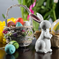 Happy easter. Easter eggs and easter decoration on the wooden table.