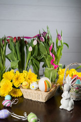 Happy easter. Easter eggs and easter decoration on the wooden table.