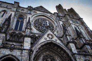 Cathedral of Saint John the Divine gothic facade in New York. - obrazy, fototapety, plakaty