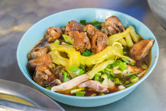 Thai rice noodle chicken in Thai when we call “Kuai Tiao Kai Mara” is the delicious Thai street food.