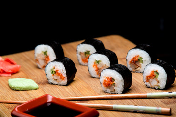 Traditional fresh Japanese sushi rolls with shrimp and caviar