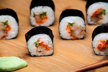Traditional fresh Japanese sushi rolls with shrimp and caviar
