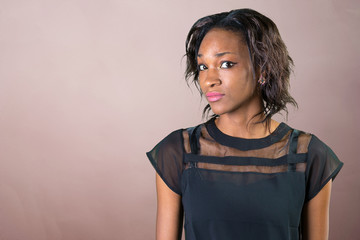 Astonished young african woman