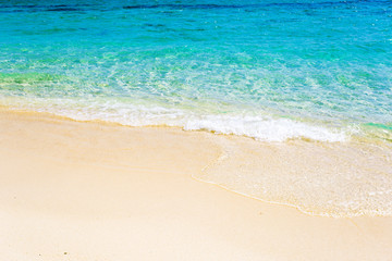 Wave of the sea on the sand beach