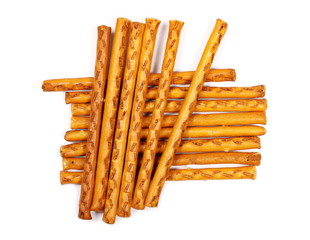 Salty cracker pretzel sticks isolated on white background, top view
