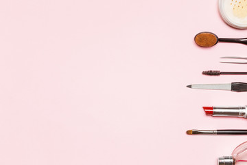 lay flat with various cosmetics on a blue background. A lot of free space for your text. the picture on the price for the makeup artist or beauty salon 