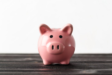 piggy bank on the old wooden background