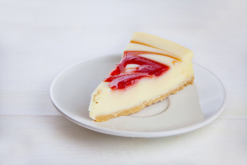 delicious cheesecake with strawberries on  plate