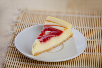 delicious cheesecake with strawberries on  plate