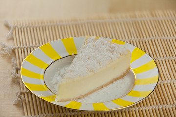delicious cheesecake with coconut on  plate