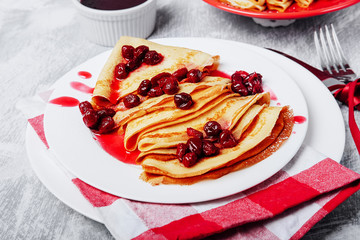 Russian pancakes with cornelian cherry jam