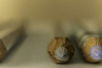 Macro photography  of gray  pencils. Blurred perspective. Mechanical sharpening of pencils. Photo for the site about art, hobbies, education.