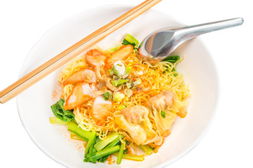 The egg noodle and pork wonton soup with red roasted pork delicious street food of Thailand.