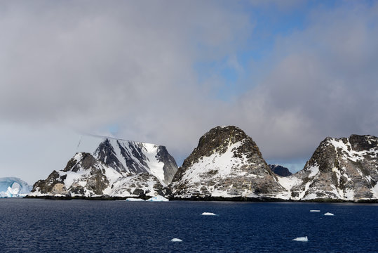 Rocks with snow in sea