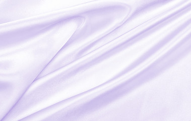 Smooth elegant lilac silk or satin texture as wedding background. Luxurious valentine day background design