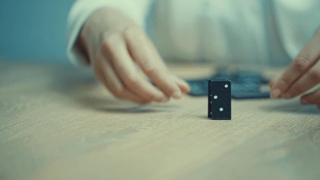 office, person, manage, game, domino, prevent, problem, woman, strategy, stop, risk, continuity, row, block, businesswoman, black, business, action, motion, one, people, reaction, desk, entrepreneursh