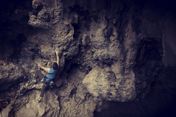 Rock-climbing in Turkey. The climber climbs on the route. Photo from the top.