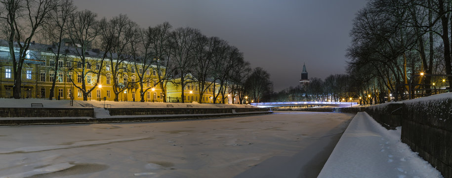 Turku by night. Urban landscape with frozen river.