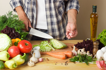 Woman cooks at the kitchen