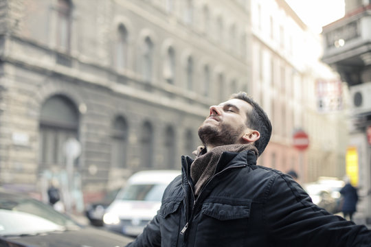 Satisfied businessman breathing in