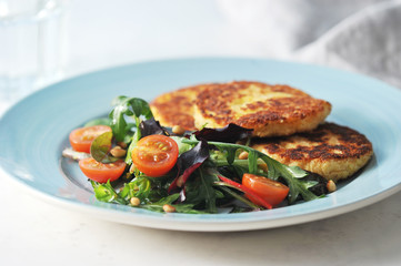 Potato cutlets and lettuce with cherry tomatoes. Proper nutrition, ideal for vegetarians.  Close-up. Macro photography.