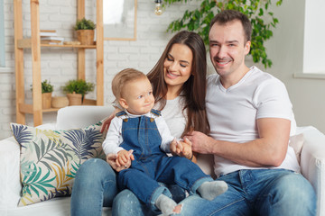 Fototapeta premium Family relaxing on sofa
