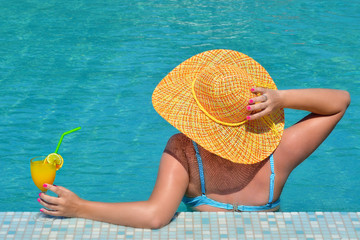 Real female beauty relaxing in swimming pool