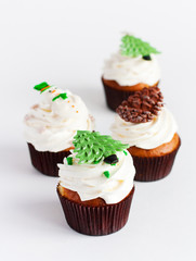 Decorated new year cupcakes on white background