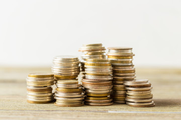 coins stack on wooden table