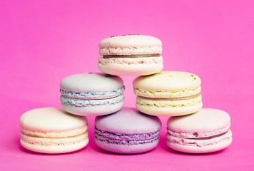 Colorful Macaroon in close up on pink background