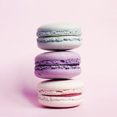 French macaroons in blue, yellow and purple