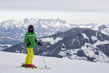 Fototapeta na wymiar Teenager skiing at the Alps