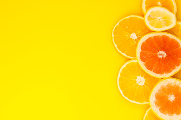 Sliced ​​eco citrus mug, lemon, orange and grapefruit on the background.
