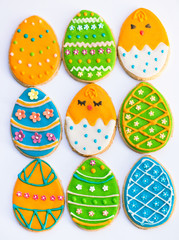 Easter eggs decorated cookies on light backround