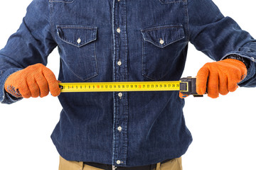 repairman (builder) holds the tape measure in his hand isolated on white background