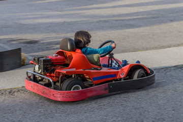 children go for a drive on karting