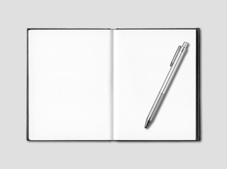 Blank open notebook and pen isolated on grey
